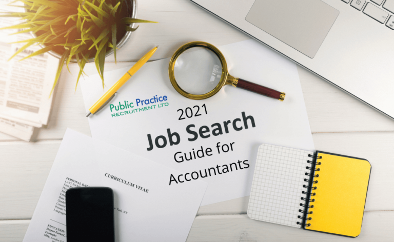 Magnifying glass, paper and pen next to a job search guide for accountants